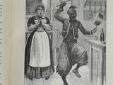 un livre ouvert sur lequel figure l'image d'un homme et d'une femme dans une cuisine