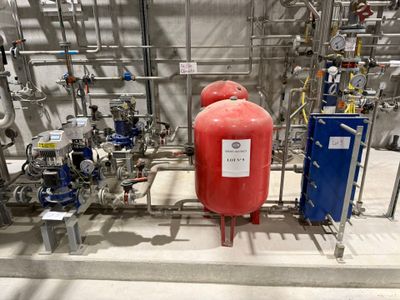 a large red fire hydrant in the middle of a room