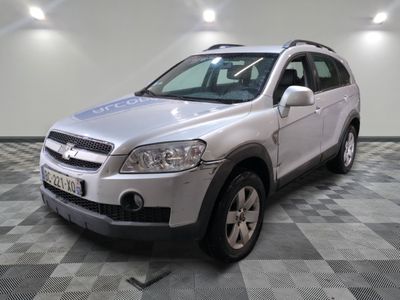 a picture of a silver suv parked in a garage