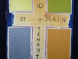 une peinture représentant une croix sur laquelle sont inscrits des mots