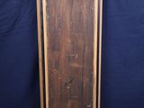an old wooden door with a black background and a blue backdrop