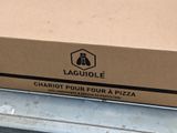 a box of pizza sitting on the back of a truck