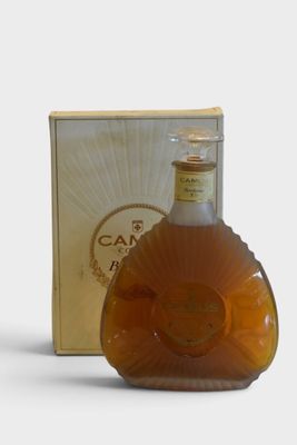 an image of a bottle of brandy sitting next to a box