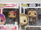 funko pop star wars vinyl figures are on display in a store