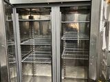 stainless steel double door refrigerator in a commercial kitchen