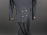 a blue suit with red fringes on the shoulders and shoulders