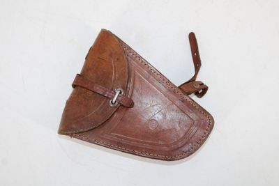 brown leather holster with a leather strap on a white background