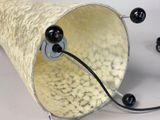 an image of a lamp that has black beads on it