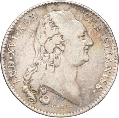 Gros plan sur une pièce de monnaie portant le visage d'un homme