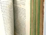 an open book that is sitting on a table