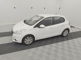 a picture of a small white car parked in a garage