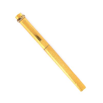 a close up of a pen on a white surface with a white background
