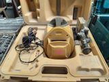 a yellow tool case with tools in it on a table