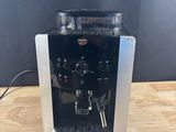 a close up of a coffee machine on a wooden table