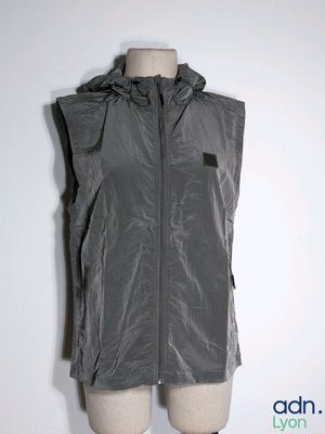 the vest is made of plastic and has a hood on it
