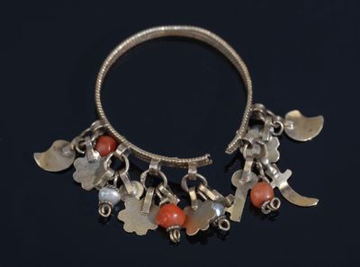 a close up of a silver bracelet with charms on it