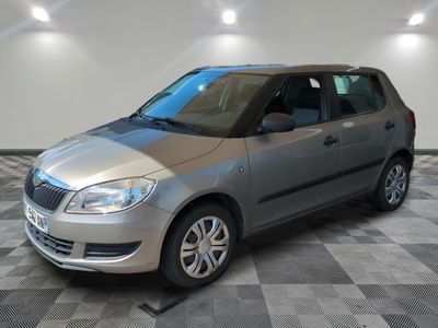 a picture of a silver car parked in a garage