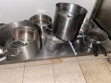 many pots and pans that are on the stove