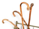 three umbrellas that are hanging on a rack