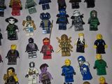 a lot of lego minifigurs that are on the table