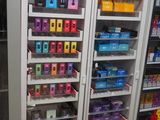 many different types of cell phones on display in a store