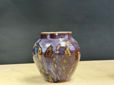 a small vase that is sitting on a table