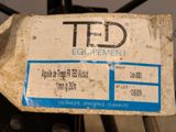 a tag on the back of a tractor that says ted equipment