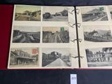 an old photo album with a bunch of pictures of trains on it