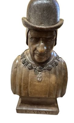 a statue of a man with a top hat on