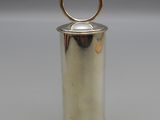 a silver metal container with a gold ring on top of it