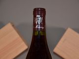 a bottle of wine that is sitting on a table