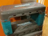 a small tool box sitting on top of a white table