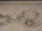 two glass dishes and a glass bowl on a table
