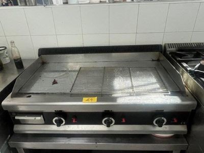 an image of a commercial gas grill in a kitchen