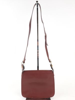 Must de Cartier sac à main forme besace en cuir Bordeaux à d…