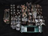 a pile of old sewing machines sitting on a black surface