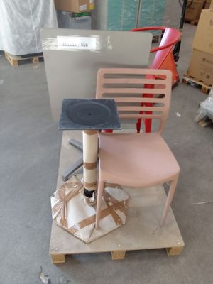 a chair that is sitting on a pallet in a warehouse