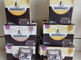 quatre boîtes de croquettes Theraway empilées les unes sur les autres