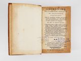 an old book opened to show the title of a poem