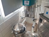 an image of a kitchen with a mixer and a bowl in it