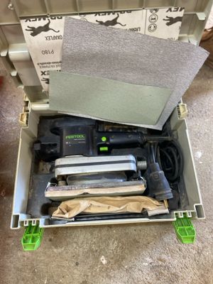 a box with tools in it sitting on the floor