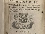 an old book with writing on it sitting on a table