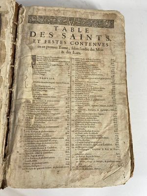 Lot de 2 livres : - Livre Table des Saints 1657 (usures) - L…
