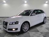 a picture of a white car parked in a showroom