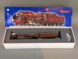 une boîte sur laquelle figure une maquette de train
