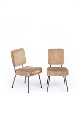pair of mid - century chairs with upholstered backrests and metal legs