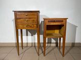 two wooden tables with drawers on them in a room