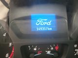 a close up of a car dashboard with a digital display