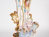 a vase that has a picture of a child on it