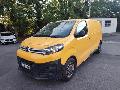 citroen van parked in a parking lot with trees in the background